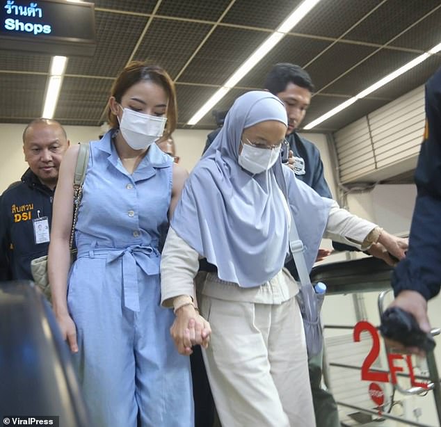 This is the moment Thai YouTuber Natthamon Khongchak (seen with her mother), 32, arrived back in Thailand in police custody after two years on the run